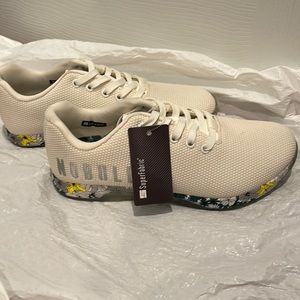 Nobull superfabric trainer. Never worn. Light beige with flower soles
